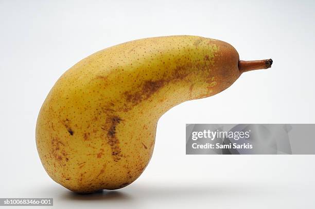 pear on white background - deformiert stock-fotos und bilder