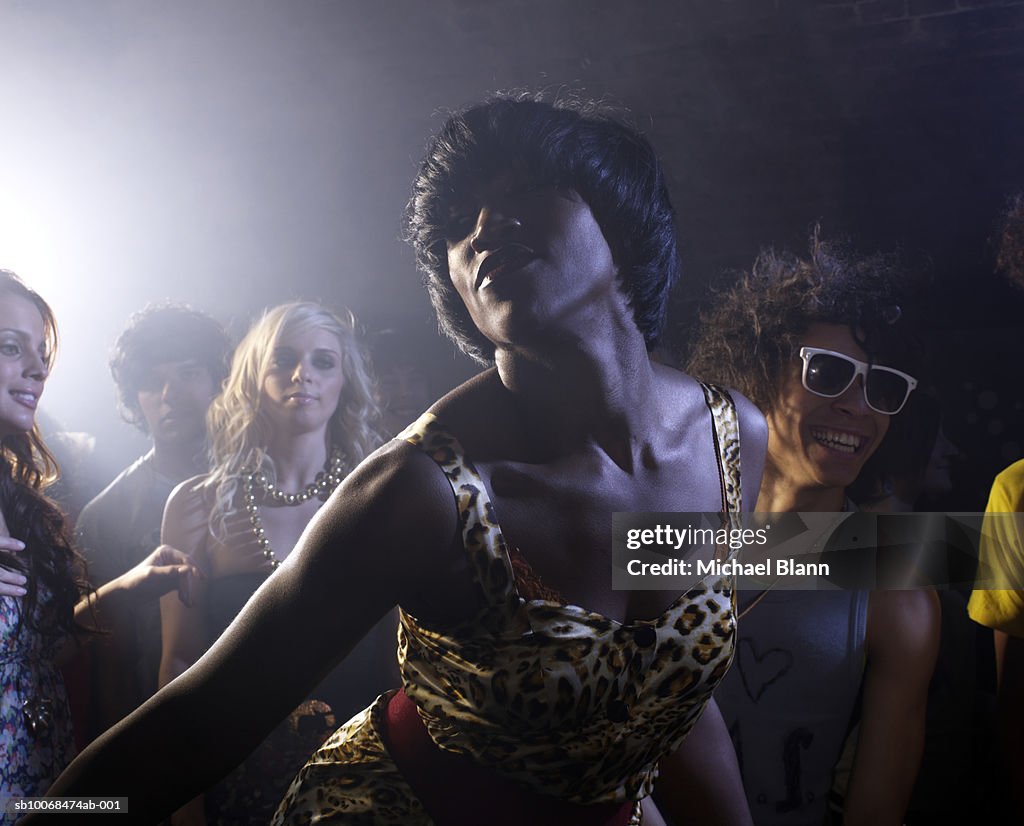 Group of friends dancing in night club