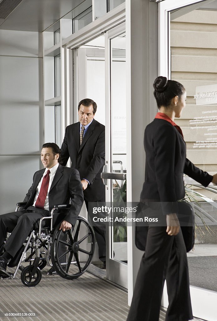 Businesspeople at office doorway