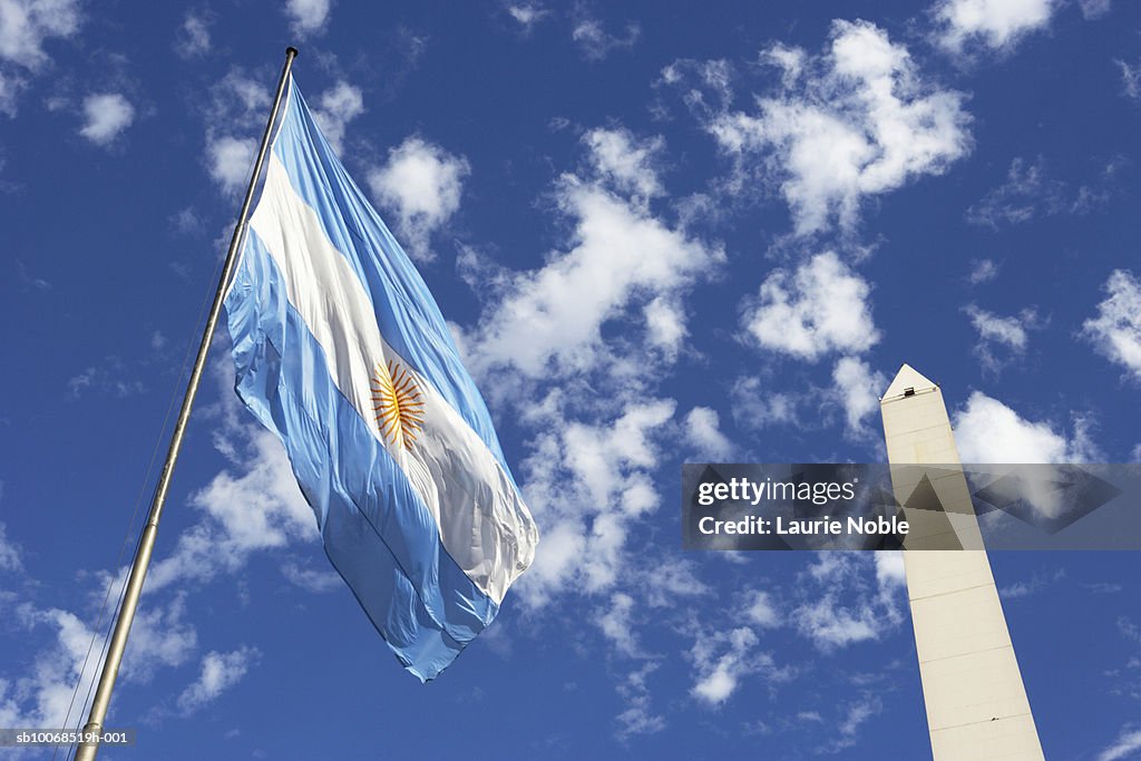Argentina, Buenos Aires, Obelisco Avenida 9 de Julio and flag