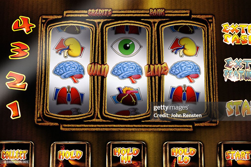 Fruit machine with health and physical themed reels, close up