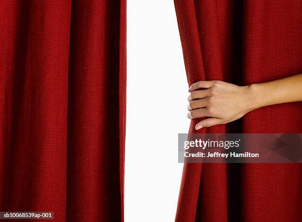 woman hand pulling curtain, close-up - curtain foto e immagini stock