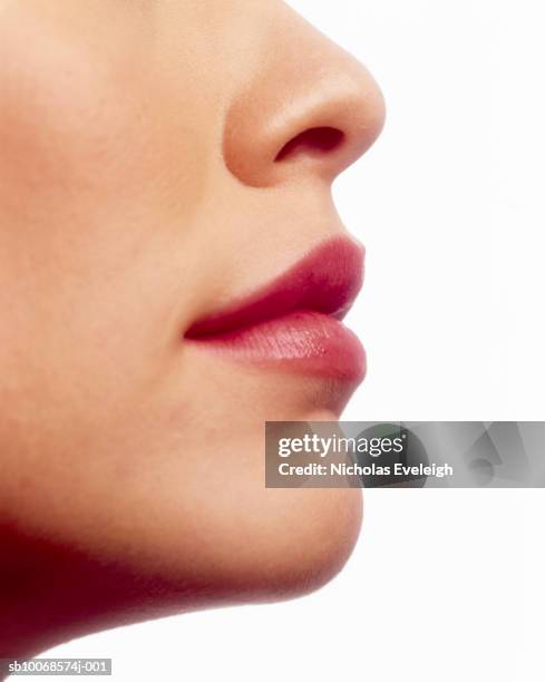 detail of young woman's face - nozes stock pictures, royalty-free photos & images