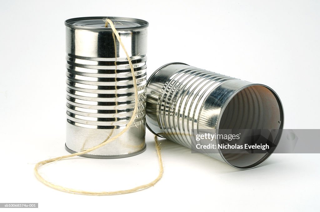 Tin can phone on white background, close-up