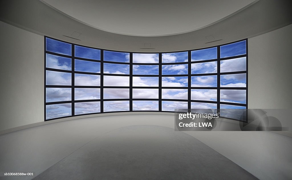 Cloudy sky on multiple television monitors