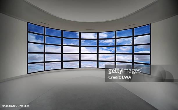 cloudy sky on multiple television monitors - tv on wall stockfoto's en -beelden