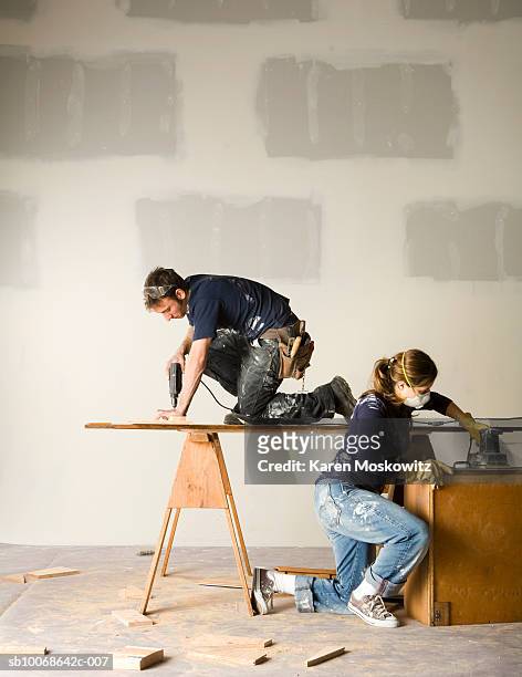 couple working on home remodelling project - power tool stock pictures, royalty-free photos & images