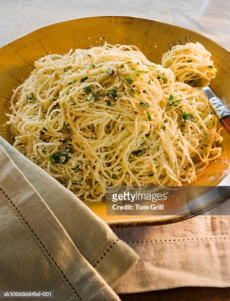 bowl of angel hair pasta with parmesan and herbs, studio shot - angel hair pasta stock pictures, royalty-free photos & images