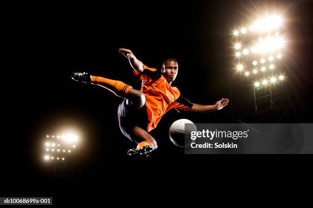 male soccer ball player kicking ball - bicycle kick stock pictures, royalty-free photos & images