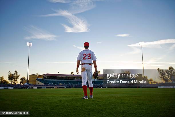usa, california, san bernardino, baseball outfielder looking towards diamond - baseball player back stock pictures, royalty-free photos & images