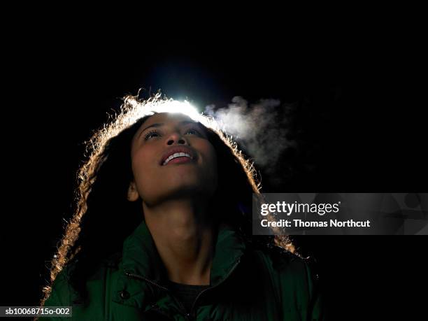 woman against black background, backlit - breath vapor stock pictures, royalty-free photos & images