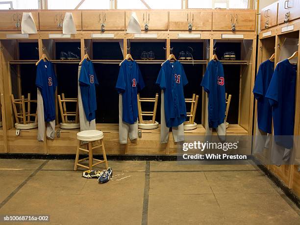 team jerseys hanging in locker room - dressing room stock pictures, royalty-free photos & images