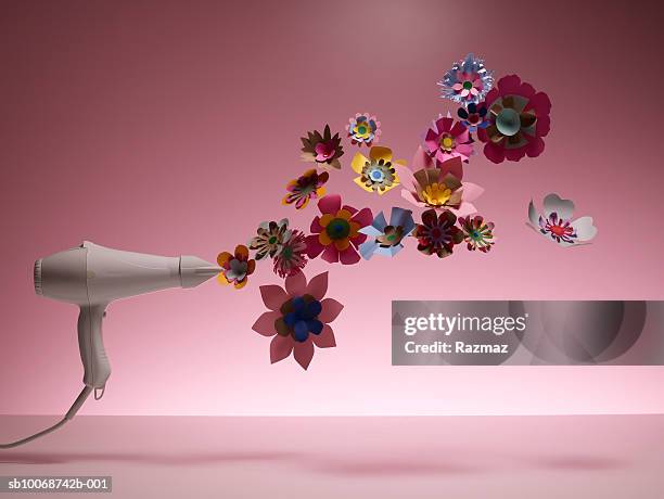 hairdryer drying artificial flower, close-up - hair dryer stock pictures, royalty-free photos & images
