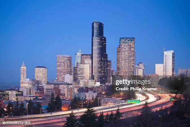 usa, washington state, seattle skyline and highway at dawn - seattle traffic stock pictures, royalty-free photos & images