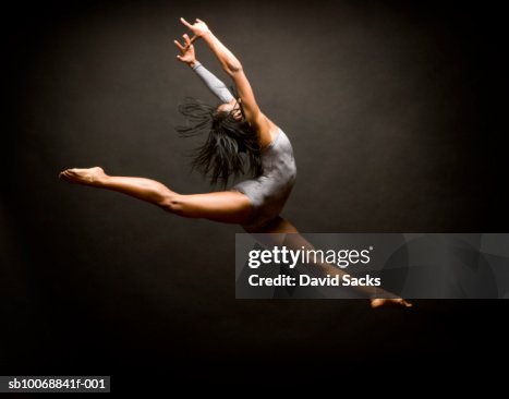 Female ballet dancer leaping in air Female ballet dancer leaping in air