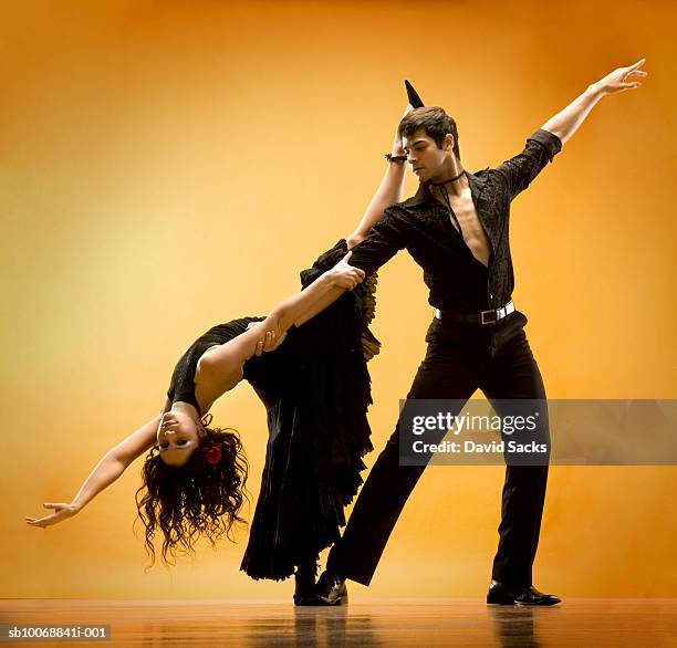 man and woman dancing - ballroom dance stock pictures, royalty-free photos & images