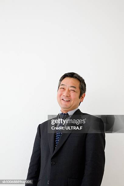 studio portrait of businessman laughing - business man laughing stock pictures, royalty-free photos & images