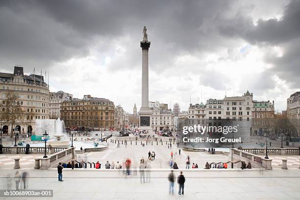 UK, London, tourists at Trafalgar Square