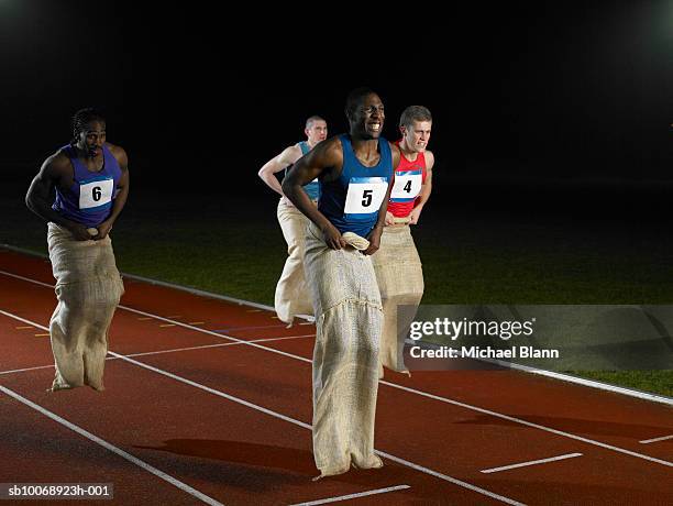 athletes competing sack race - sack race stock pictures, royalty-free photos & images