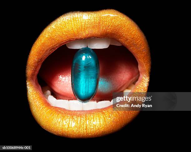medication in mouth, close-up, studio shot - mouth shut stock pictures, royalty-free photos & images