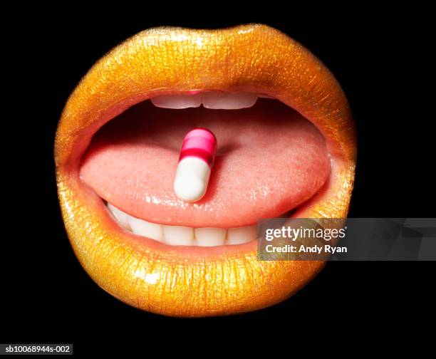 medication in mouth, close-up, studio shot - mouth shut stock pictures, royalty-free photos & images