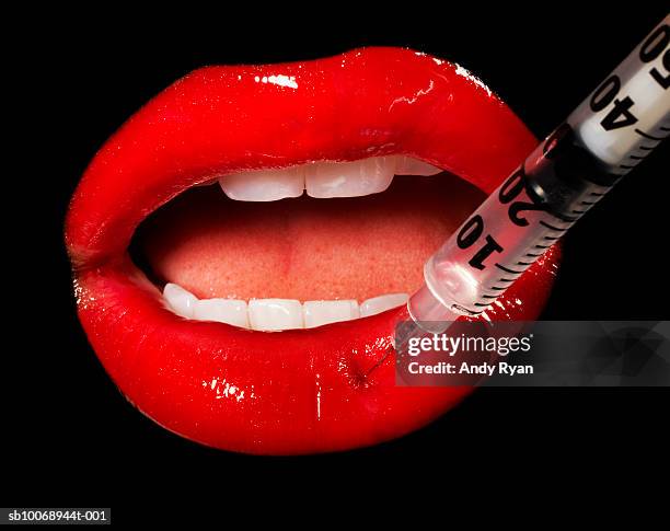 mouth having injection, close-up, studio shot - lip injections stock pictures, royalty-free photos & images