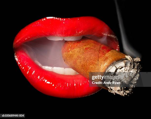 mouth smoking cigar, close-up, studio shot - cigar smokers stock pictures, royalty-free photos & images