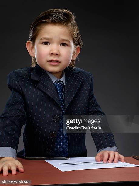boy (2-3) frowning, portrait - adult imitation stock pictures, royalty-free photos & images