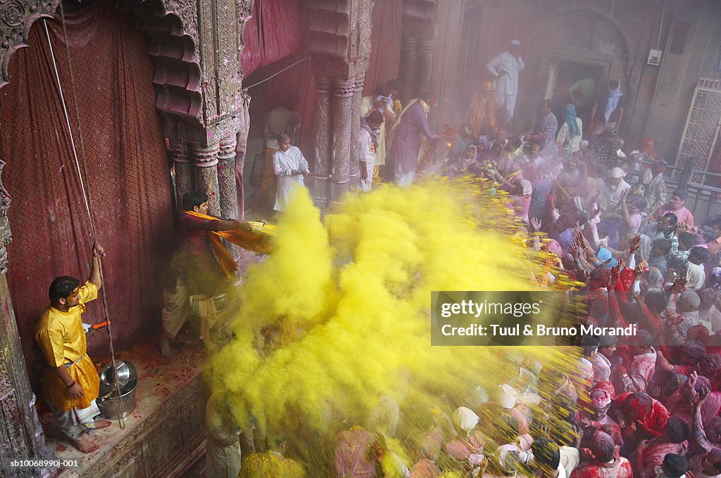 India, people in front of temple during Holi festival
