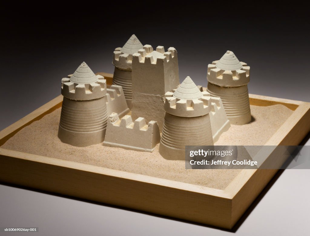 Sand castle in sand box, studio shot