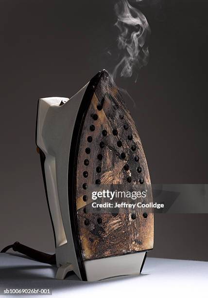 iron with bottom burnt, studio shot - iron stock pictures, royalty-free photos & images