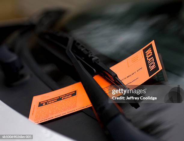 violation ticket on windshield, close-up - parking ticket stock pictures, royalty-free photos & images