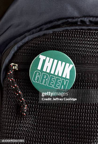 think green button on backpack, close-up - door close button stockfoto's en -beelden