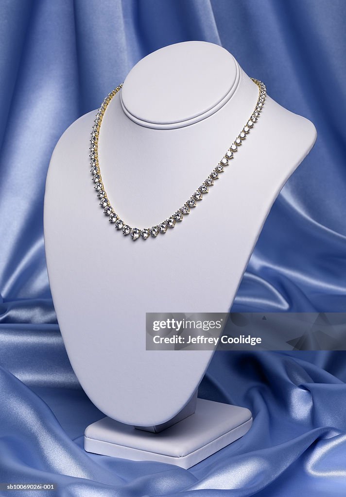 Diamond necklace on jewelry stand, studio shot
