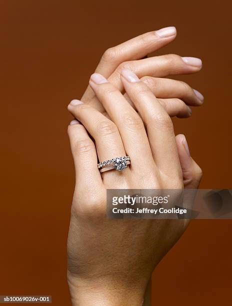 woman wearing wedding rings, close-up of hands - wedding ring stock pictures, royalty-free photos & images