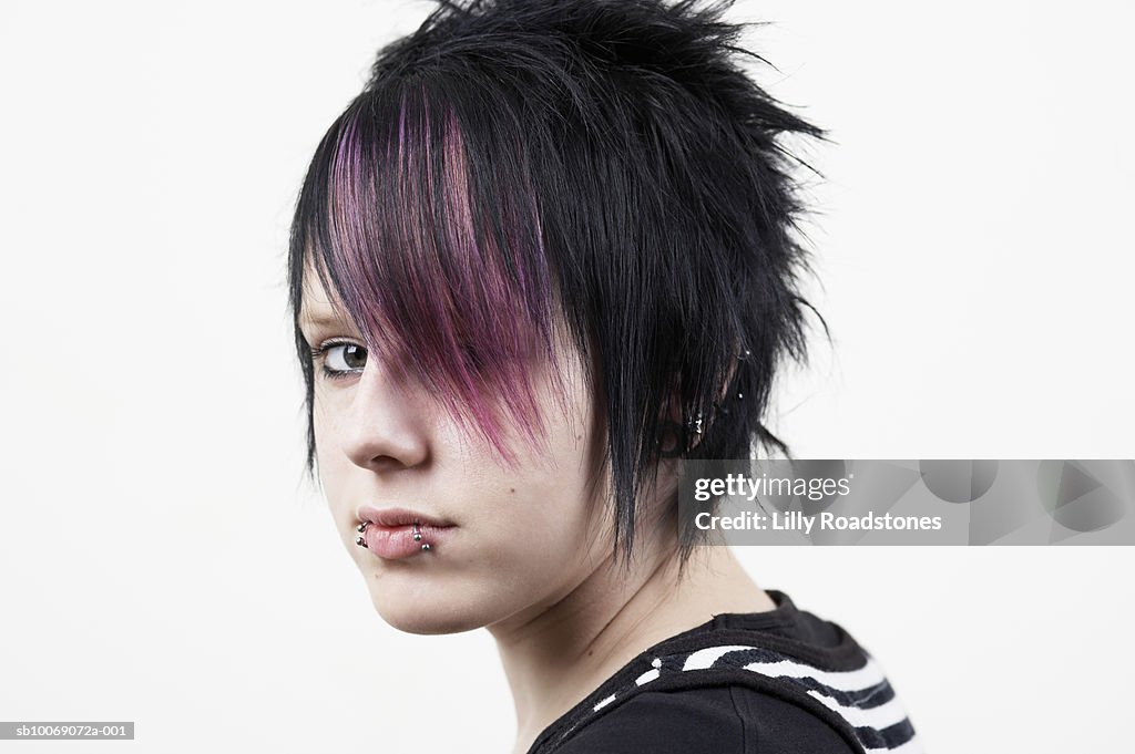 Teenage girl (14-15) with dyed hair, close-up, portrait