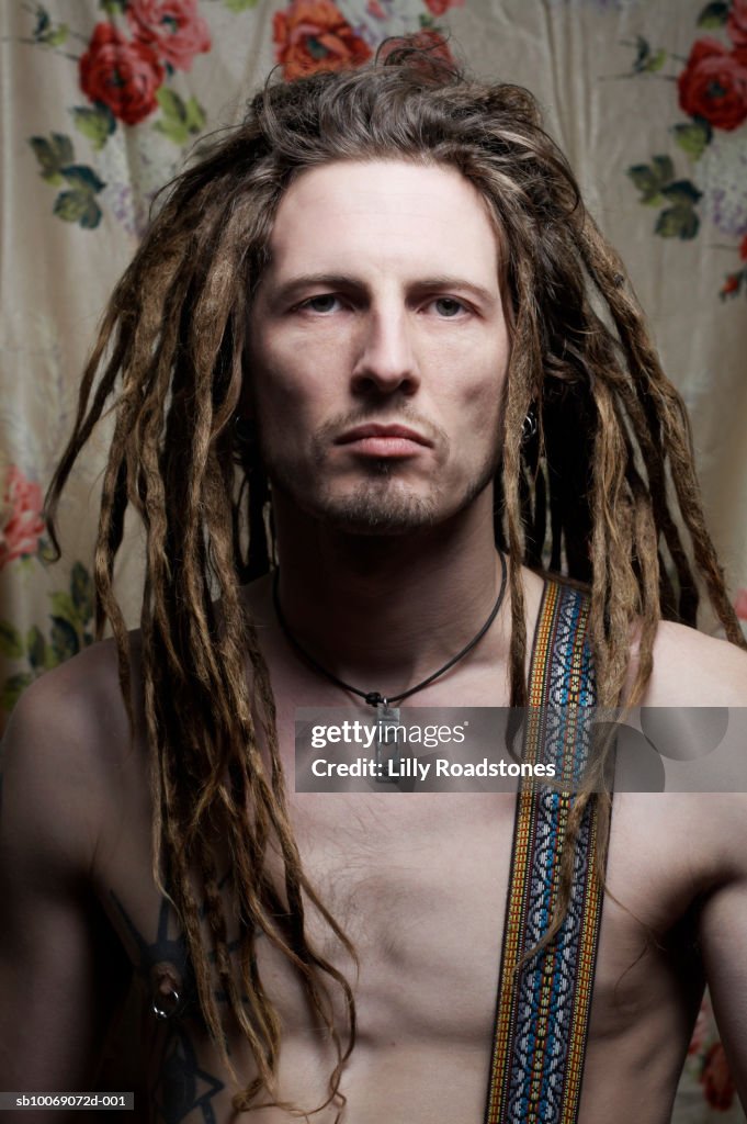 Barechested man with dreadlocks, close-up, portrait