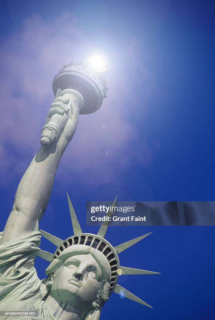 USA, New York State, New York City, Statue of Liberty with sun over torch, low angle view