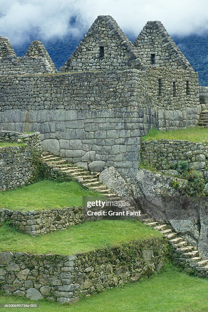 Peru, Machu Picchu, stairway and buildings of Inca ruins