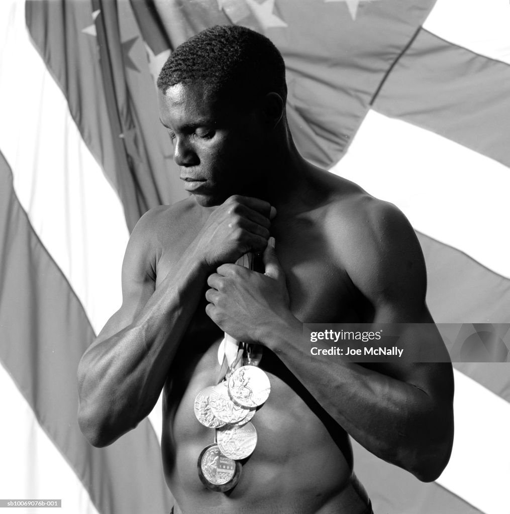 USA, Georgia, Atlanta, Carl Lewis holding medals