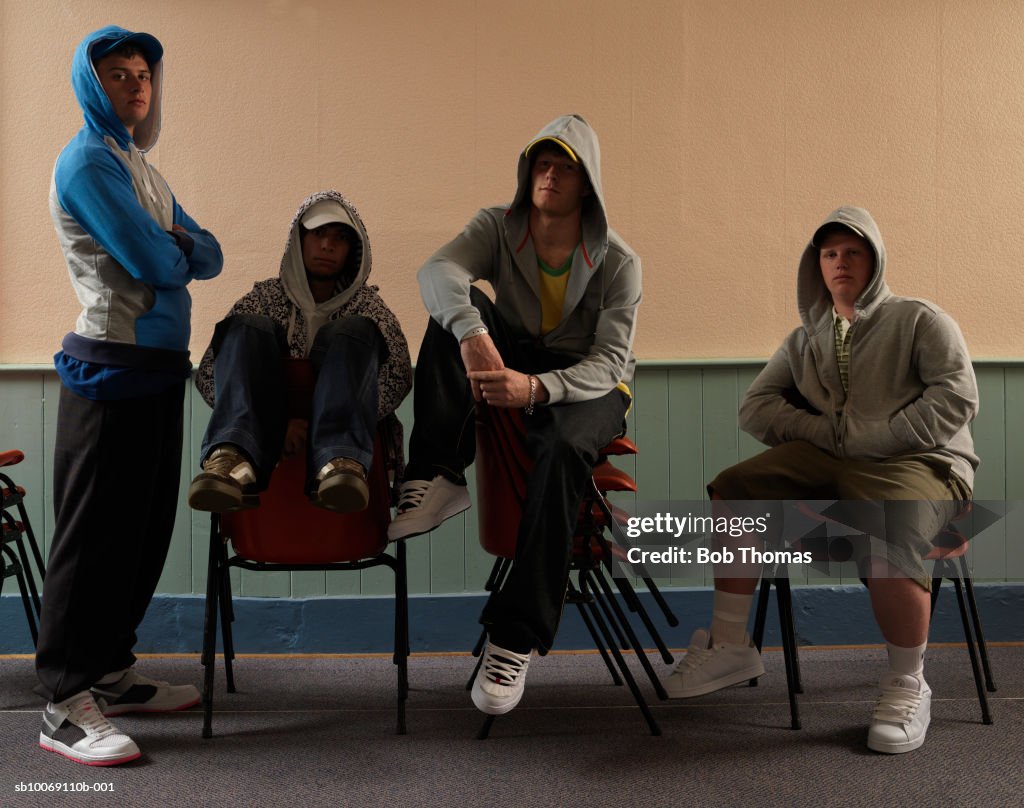 Group of young men sitting in youth club