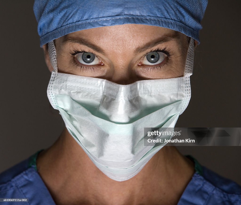Female surgeon wearing surgical mask, portrait
