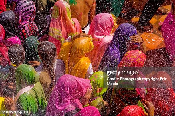 india, mathura, holi, crowd of people celebrating - holi stock pictures, royalty-free photos & images