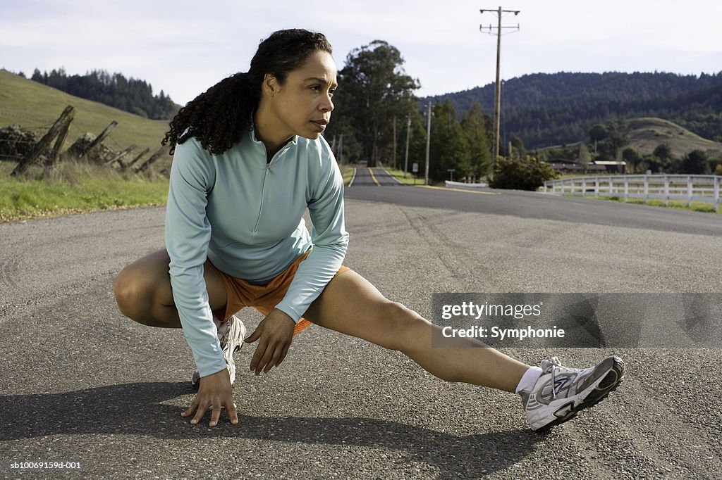Woman exercising In street