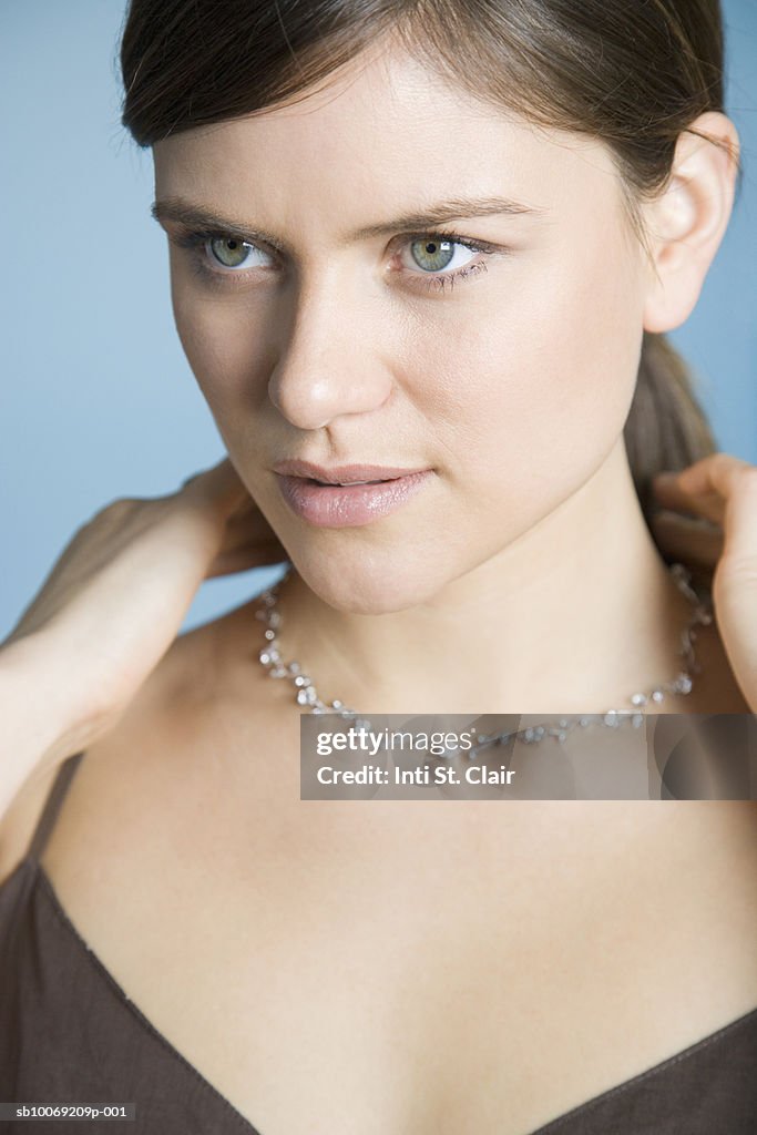 Woman trying on necklace, close up