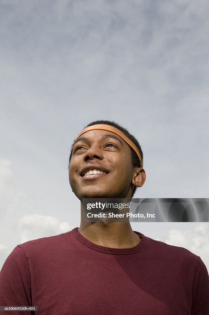 Young man looking up at sky