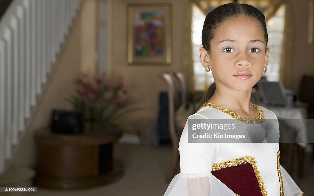 Girl (8-9) in ballerina costume, portrait