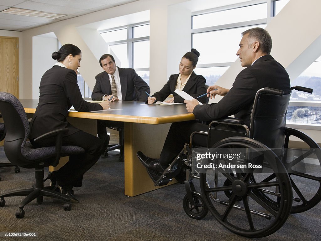 Businesspeople having meeting in conference room
