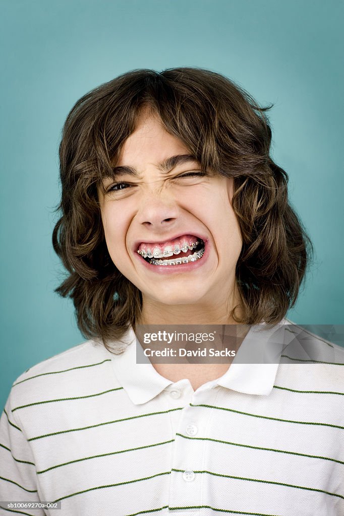 Teenage boy (14-15) with braces, portrait, close-up