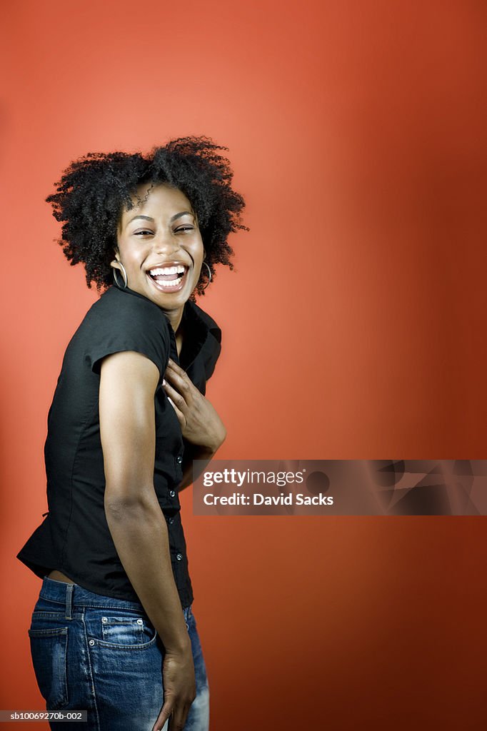 Young woman laughing, portrait